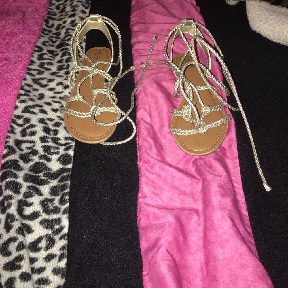 Gold gladiator shoes