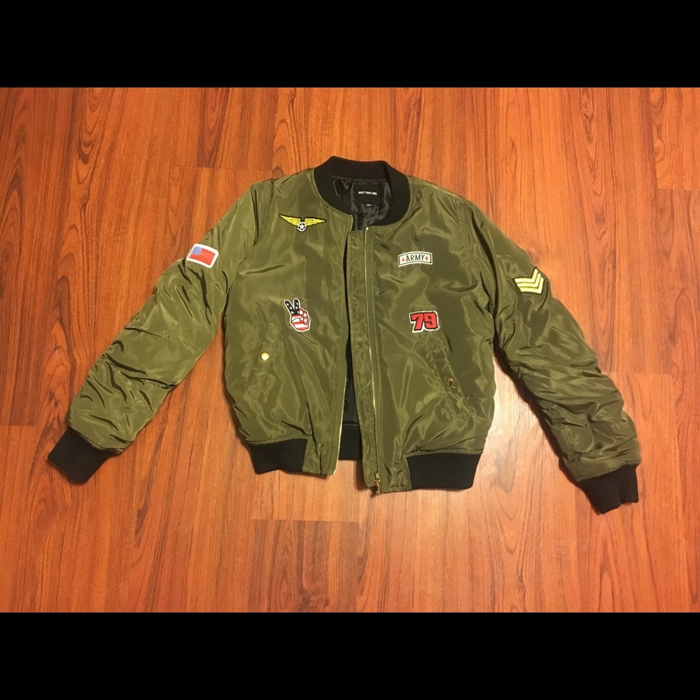 Green bomber jacket with patches