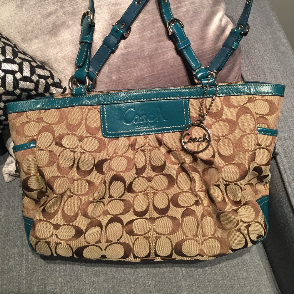 Classic coach purse with teal trim