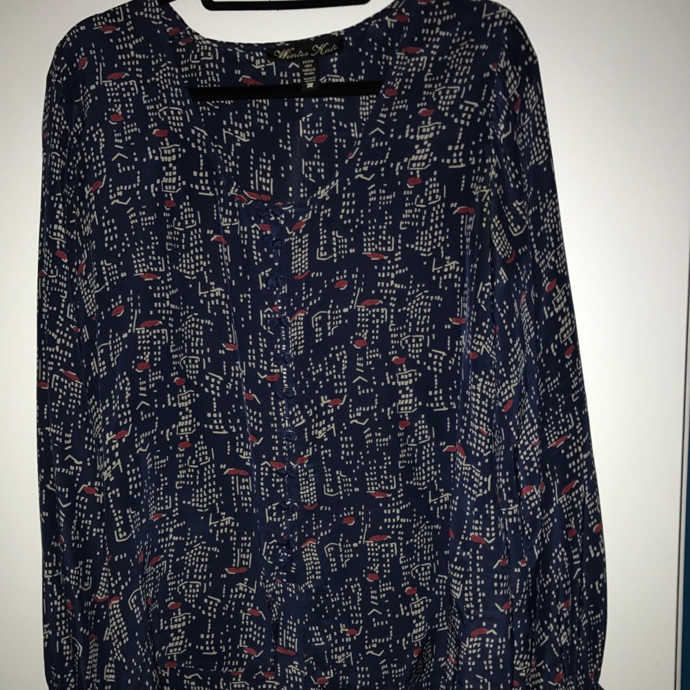 Long sleeved button up navy patterned blouse