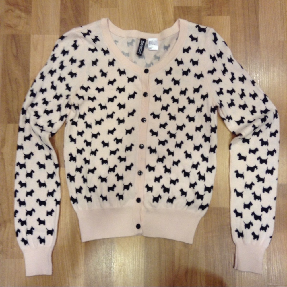 Cute pink, fitted button down sweater.
