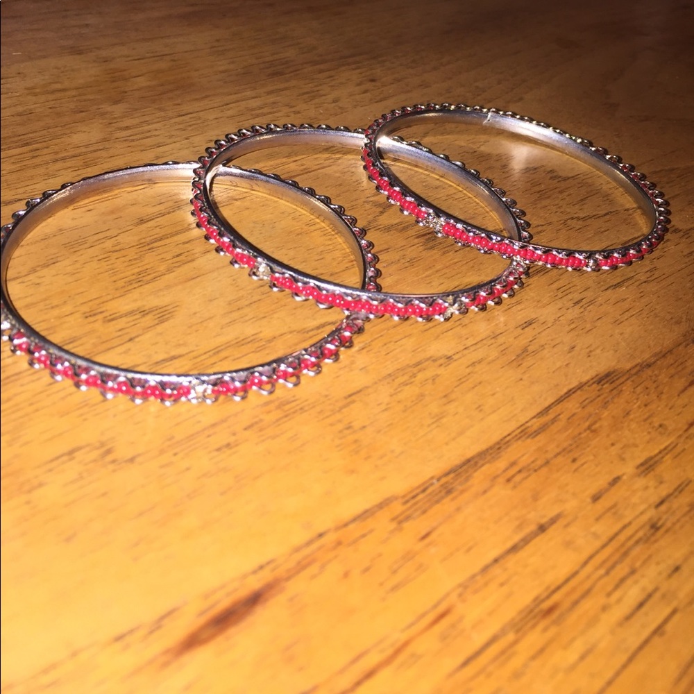 Silver and red bangles