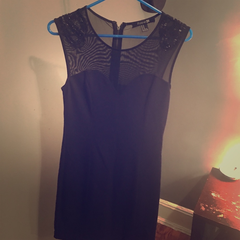 Fitted cocktail dress with sheer top and beading