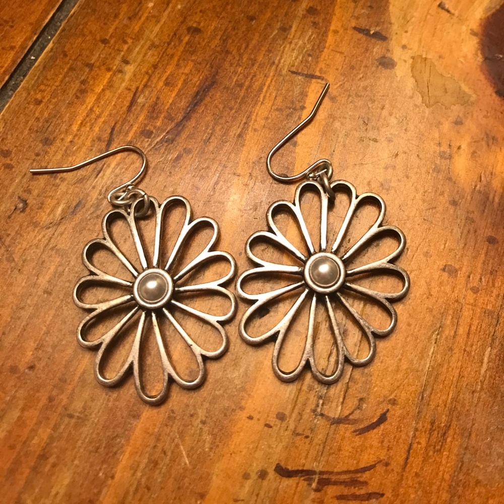 Floral earrings with pearl center.