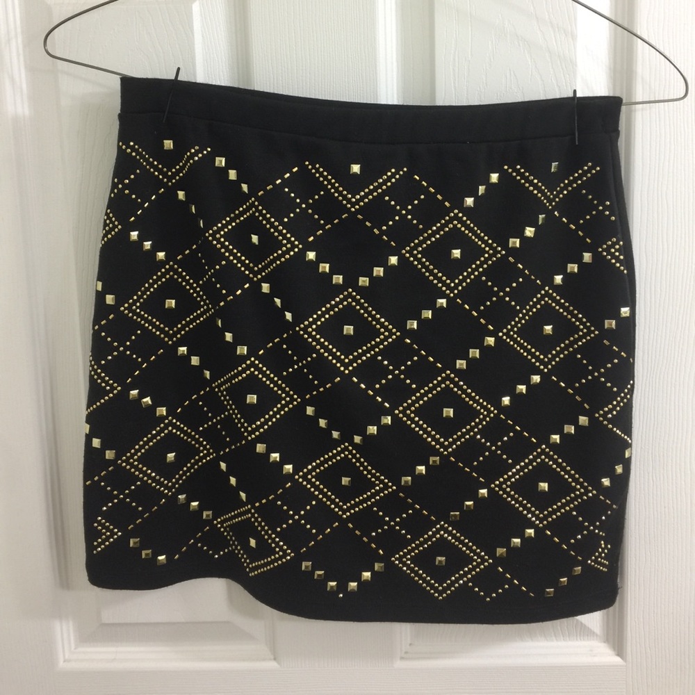 Mini skirt with gold accent only on the front.