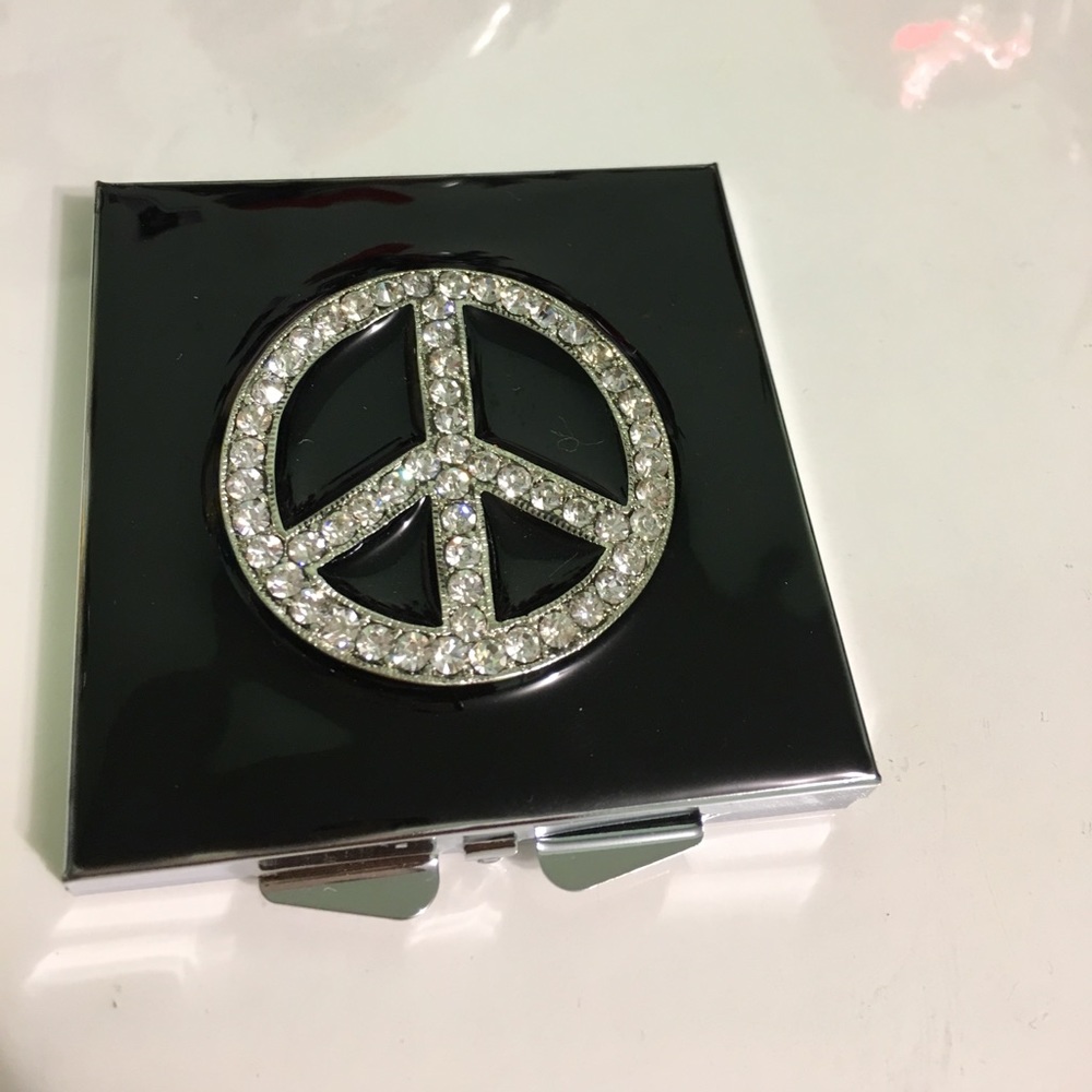 Peace sign hand mirror