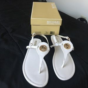 MK size 10 white flat sandals.