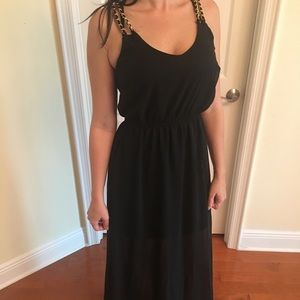 Sheer black dress with gold straps