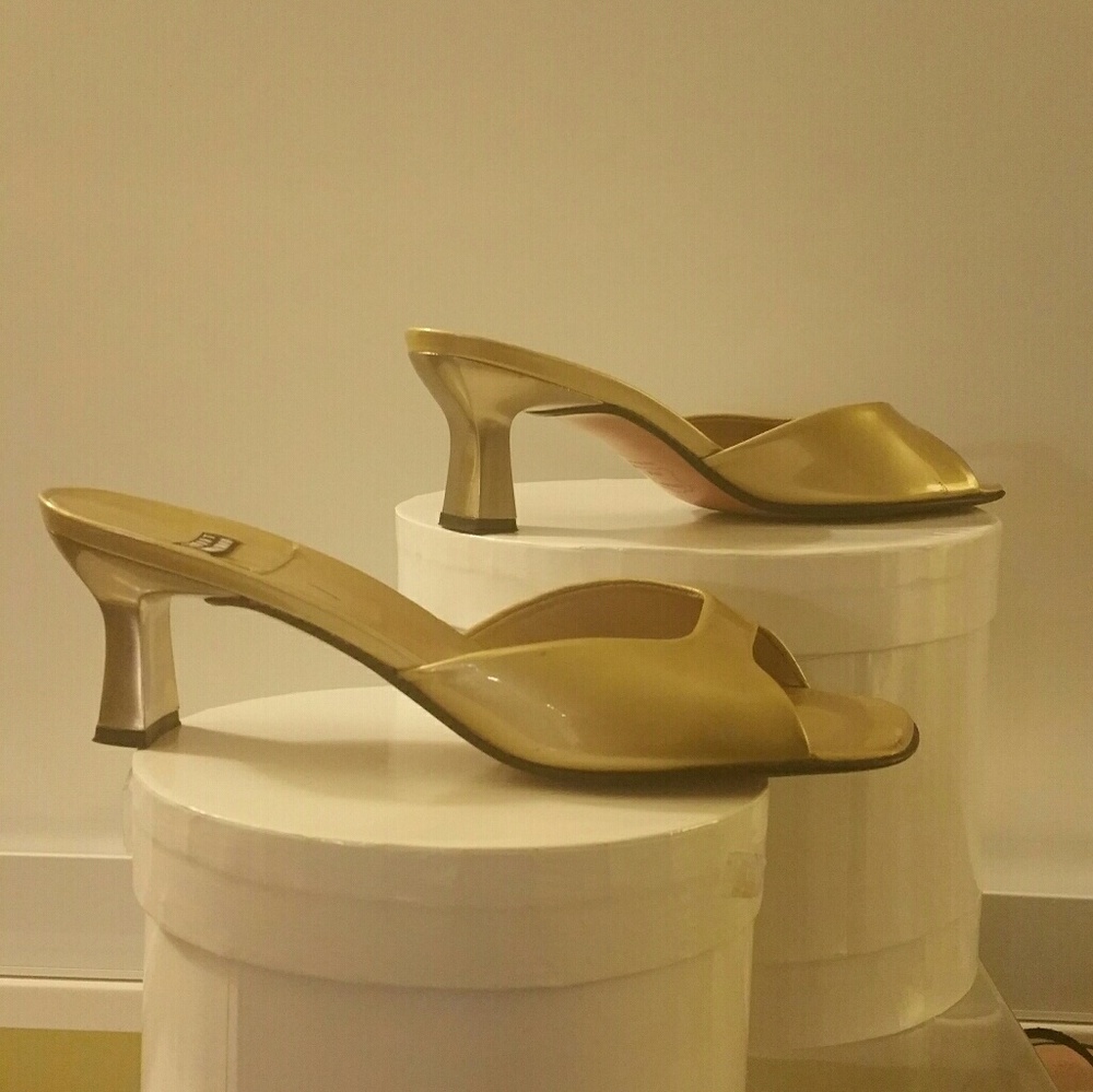 GOLD PATENT PUMPS by Stuart Weitzman