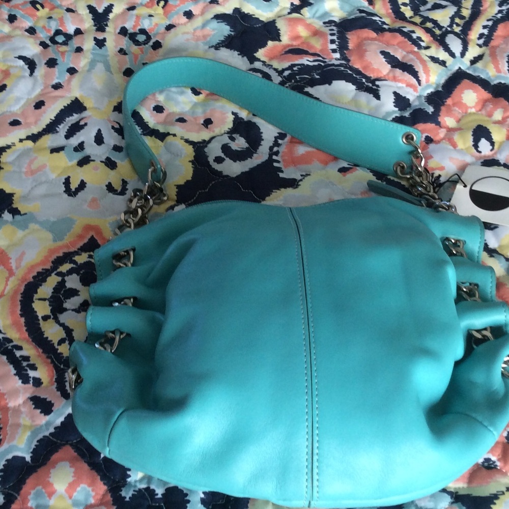 11x10 blue new purse by red tag on small scratches
