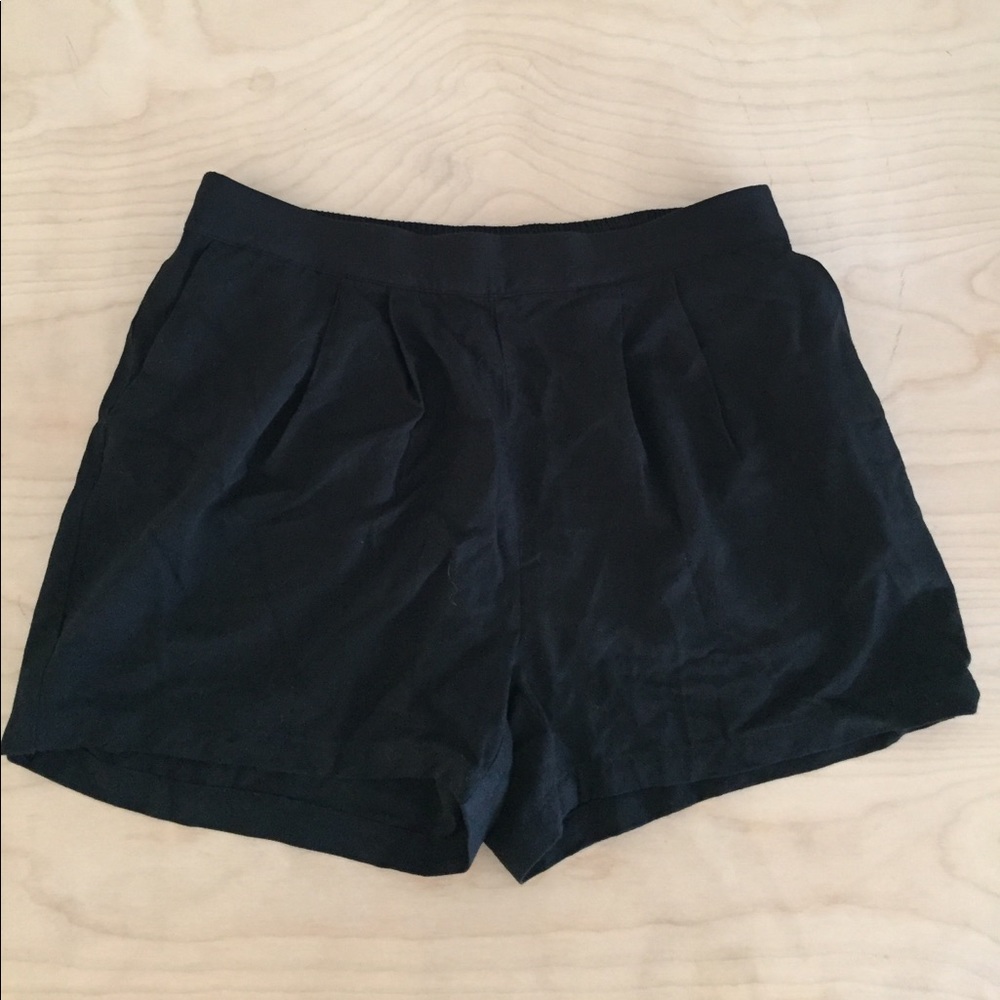 Barely worn thin pleated shorts.