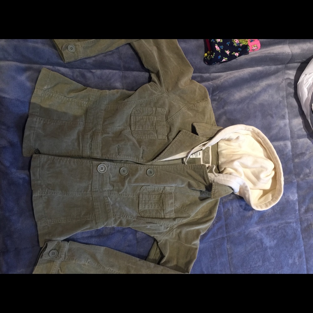 Green suede jacket with white hoodie