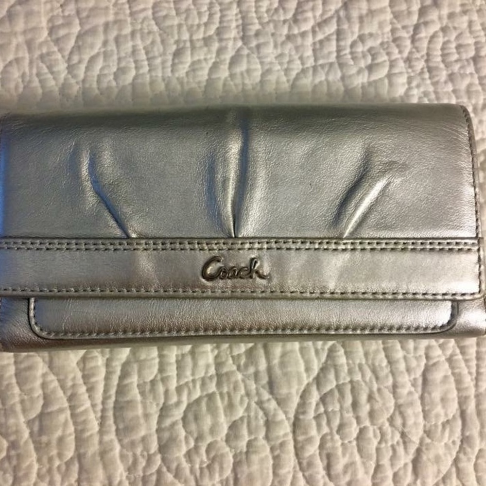 Coach silver envelope wallet.