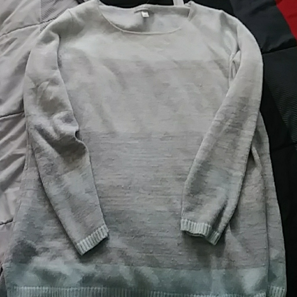 Dress barn sweater has a small stain on top front