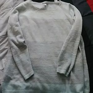 Dress barn sweater has a small stain on top front