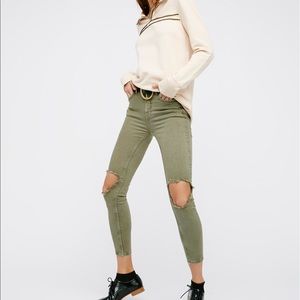 Army green high rise busted skinny jeans.