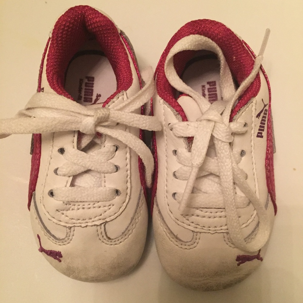 Pink and white puma tennis shoes