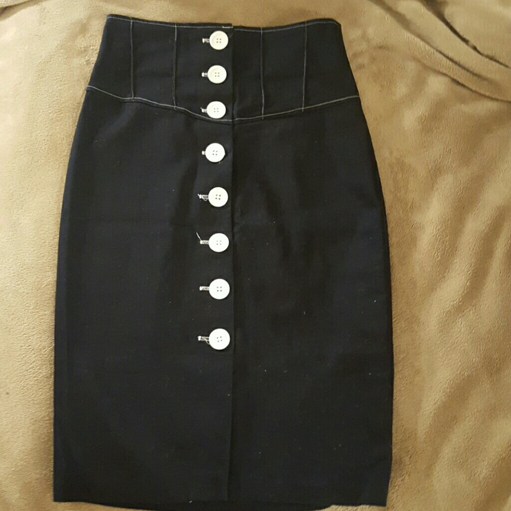 long dark blue pencil skirt with white buttons