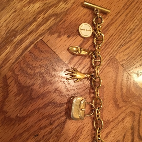 Gucci Sterling Silver Trademark Charm Bracelet 1822280  Authentic Vintage Gucci charm bracelet.
