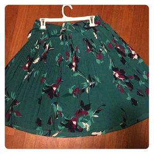 Green and burgundy floral skirt.