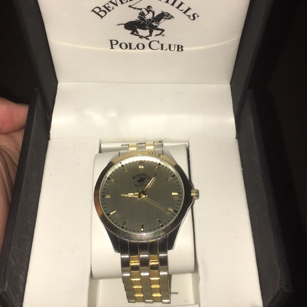 I am selling a gold, silver, and platinum watch