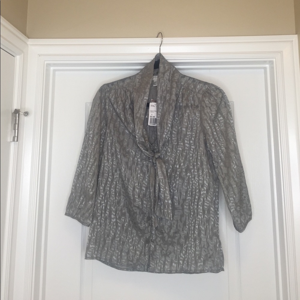 Woven top with leopard print and scarf detail.