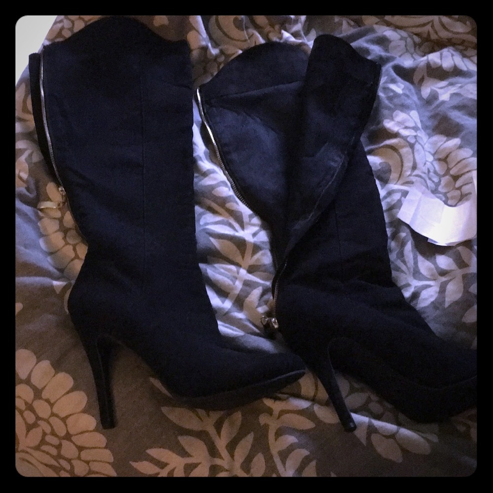 Heeled boots with gold zipper down the back