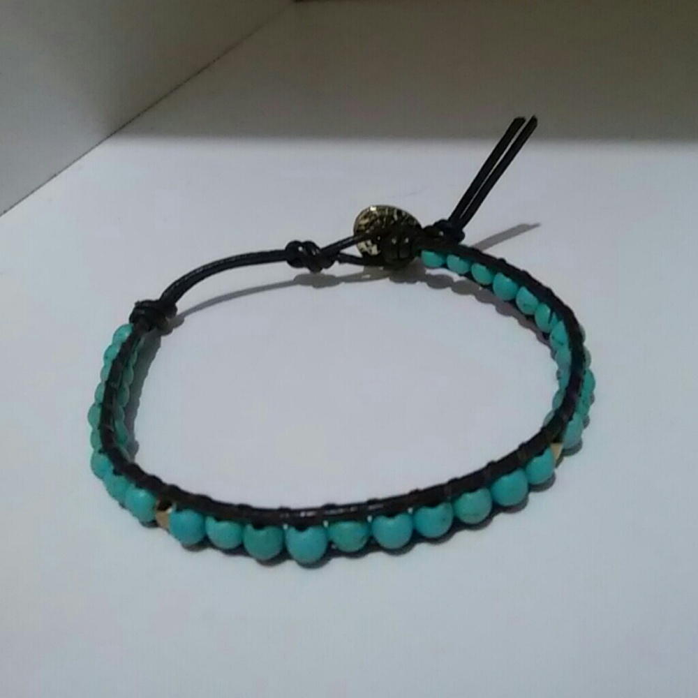 Brown rope bracelet with aqua and gold accent bead