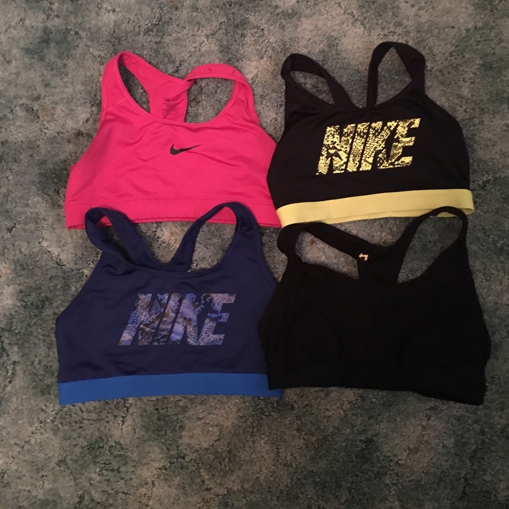 3 like new Nike sport bras and 1 black xversion