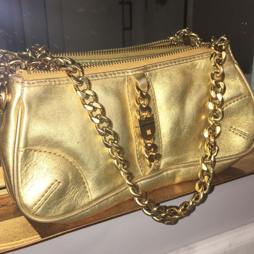 Juicy contour gold hand bag