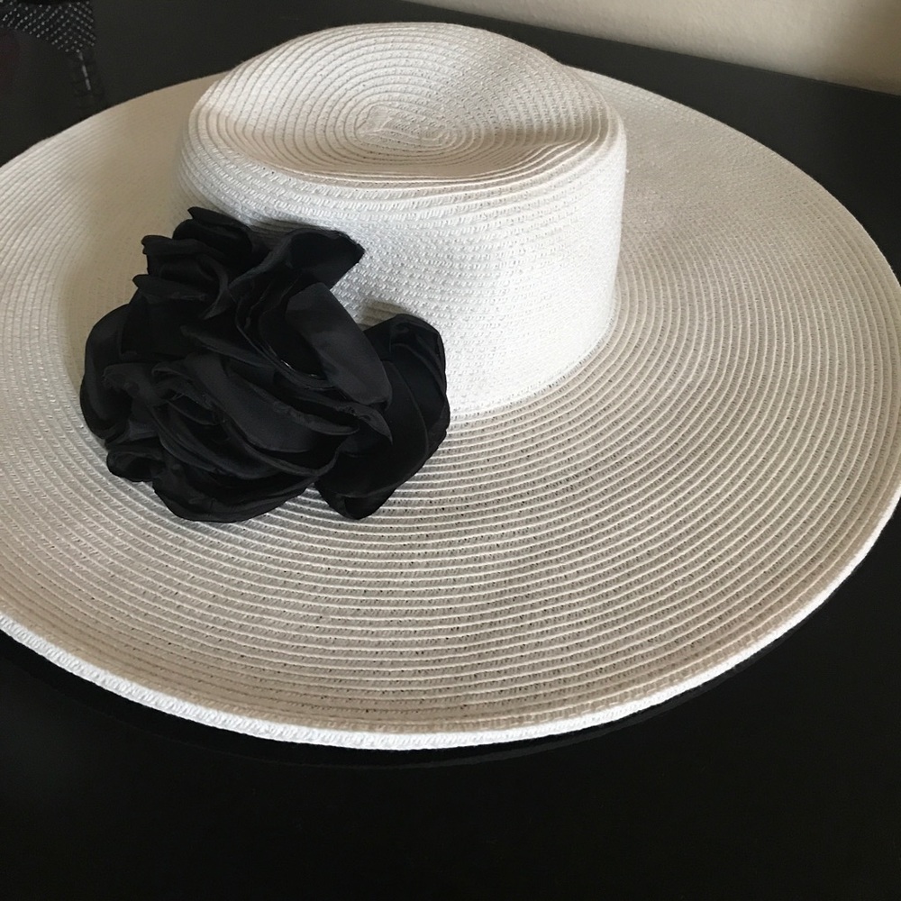 White hat with black flower.