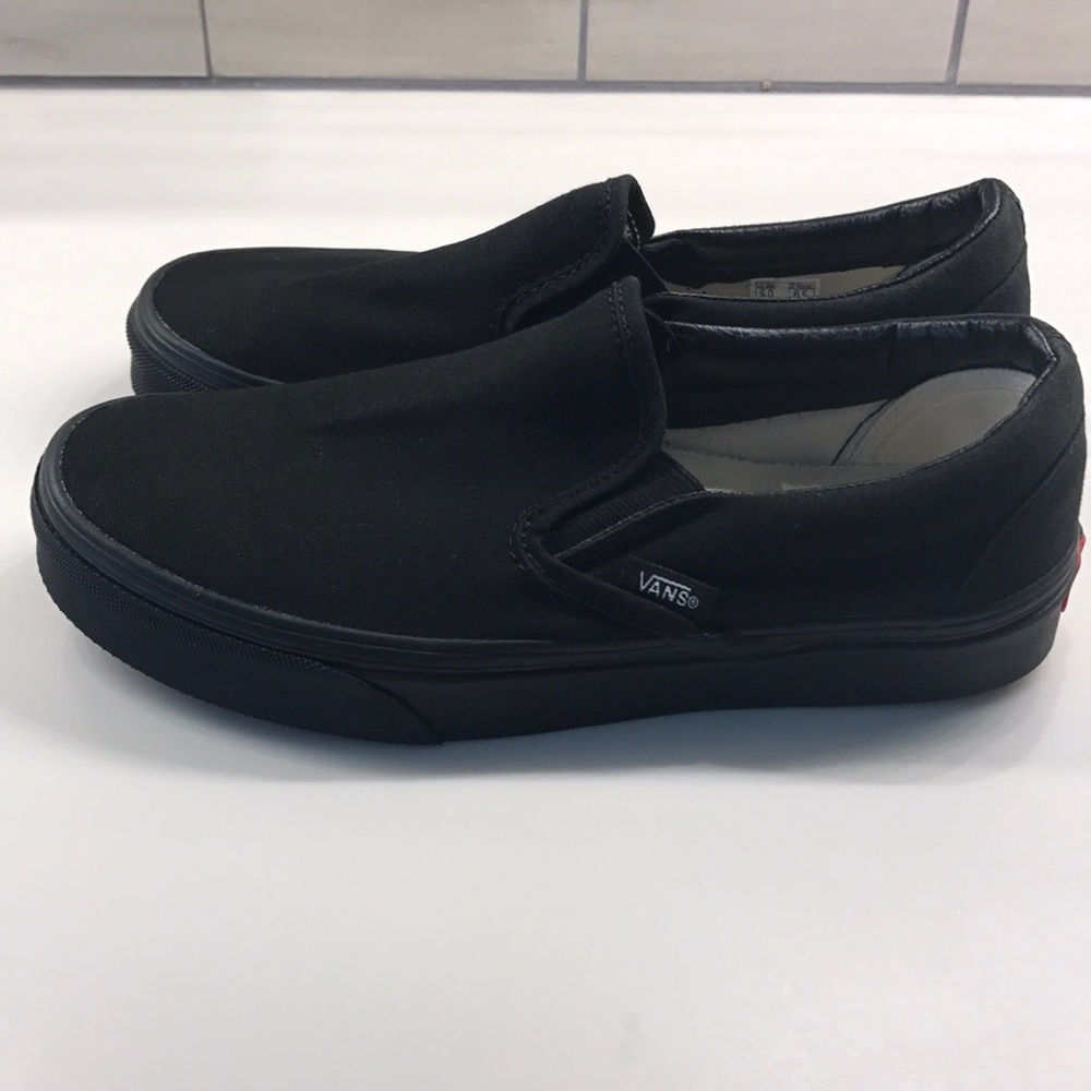 Vans of the wall Black on Black slip ons