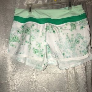 Green and white floral athletic shorts