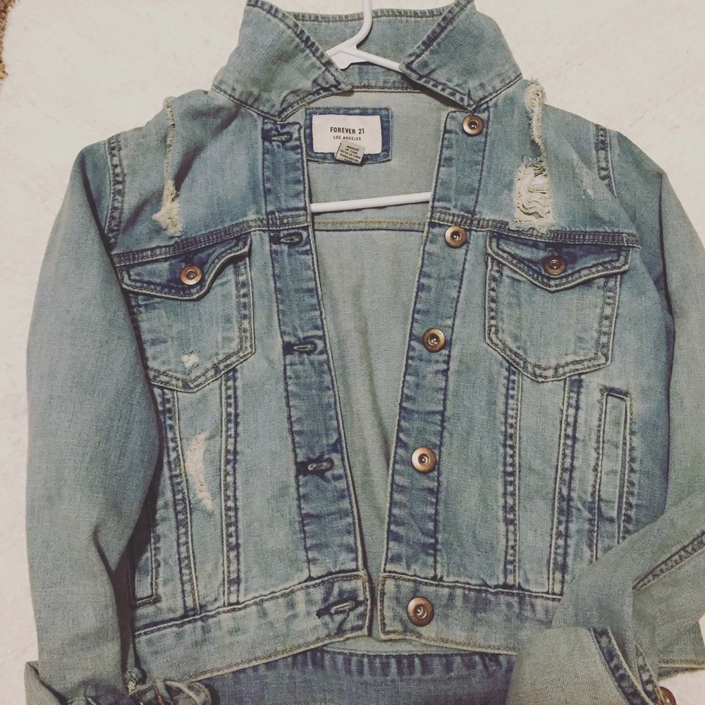 Distressed light wash denim jacket