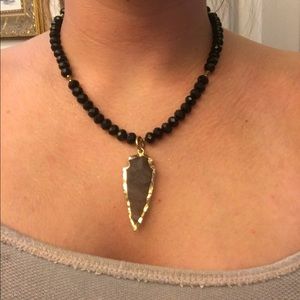 Grey gold and black arrow head necklace