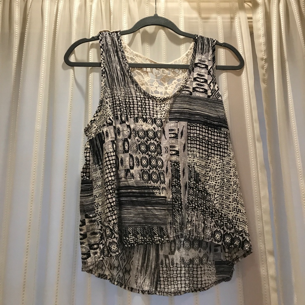 Black and white tank top with face on back