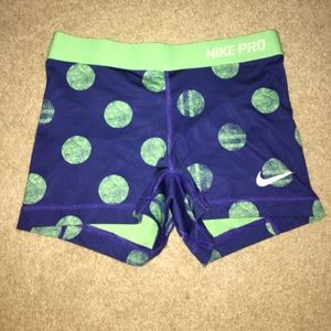 Navy blue Nike Pro Spandex with green polka dots