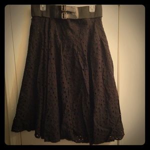 (1) black (1) cream color knee length skirt