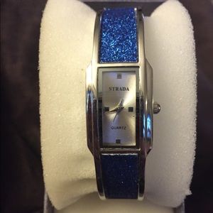 Strada Ladies Silver Bangle Watch w/ Blue Glitter