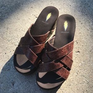 Brown embossed wedges. Not real leather.