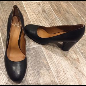 Black 3 inch Franco Sarto pumps.