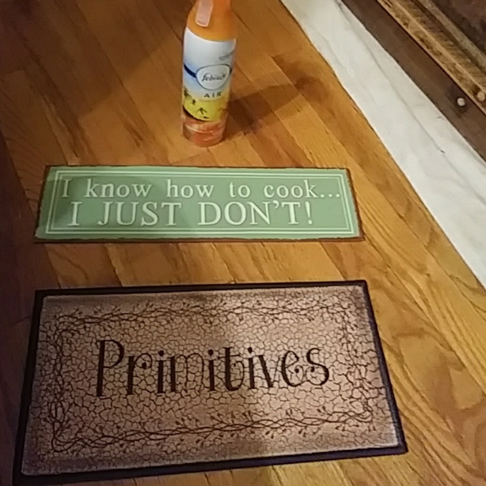 TWO METAL PRIMITIVE SIGNS
