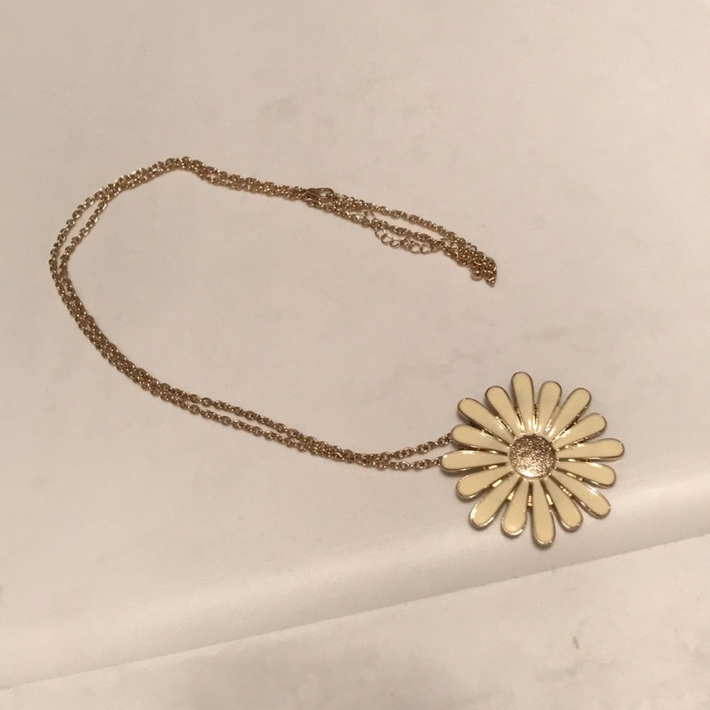 Long gold chain necklace with bold flower