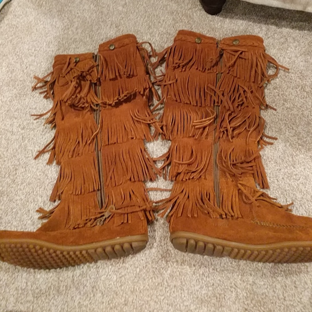 Five fringe Minnetonka boots