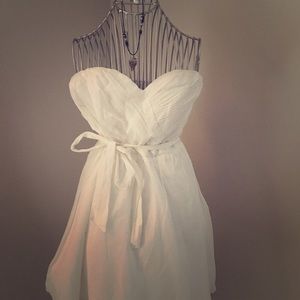 White sweetheart shaped strapless summer dress.