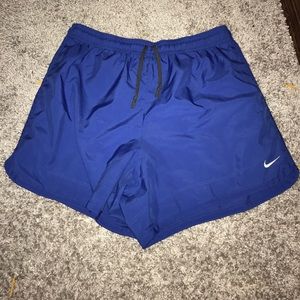 Blue Nike Dri-Fit running shorts