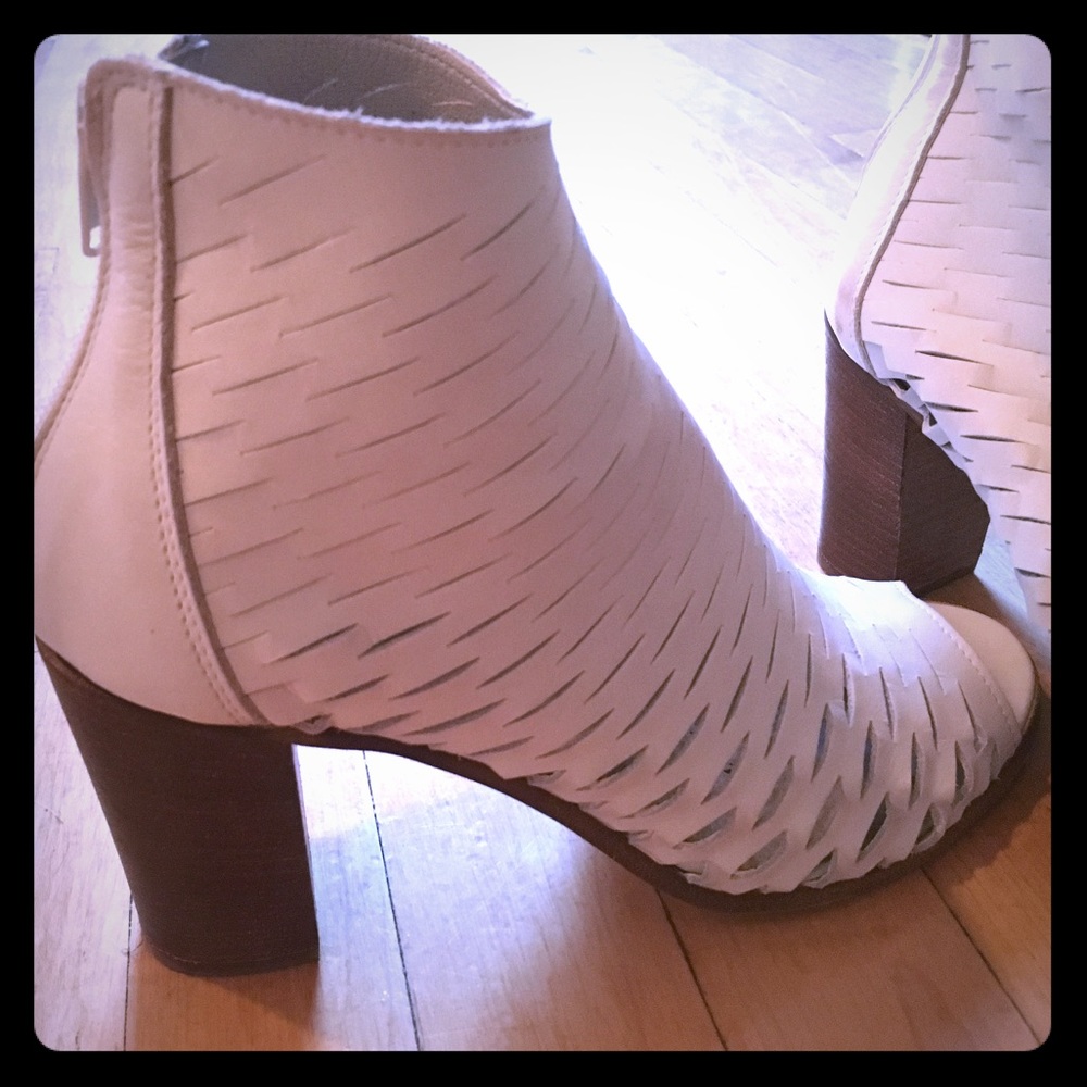 White laser cut peep toe booties