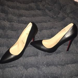 Black pumps with red soles