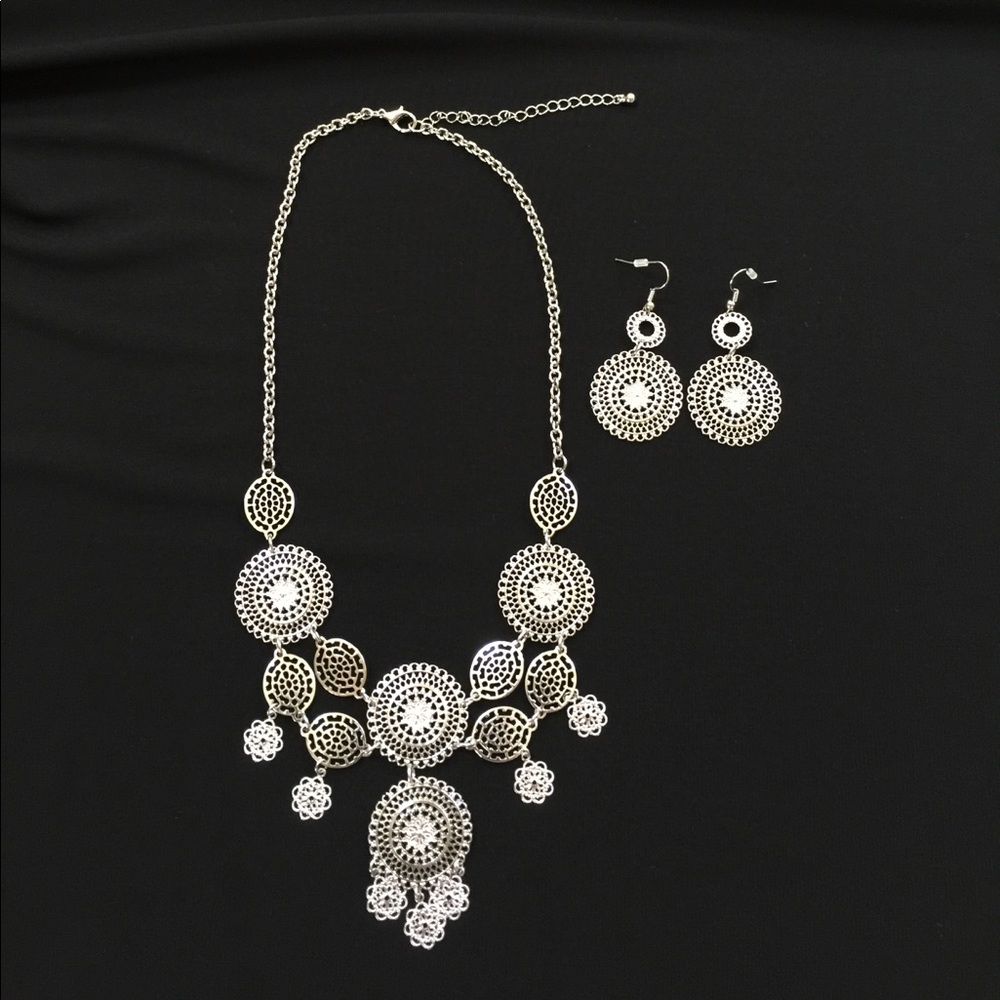 NWOT. Silver tone necklace and earrings.