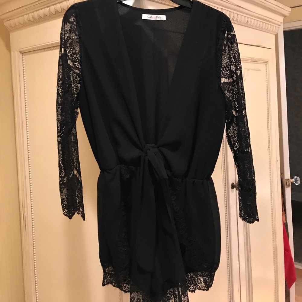 Black romper with lace sleeves and tie in front